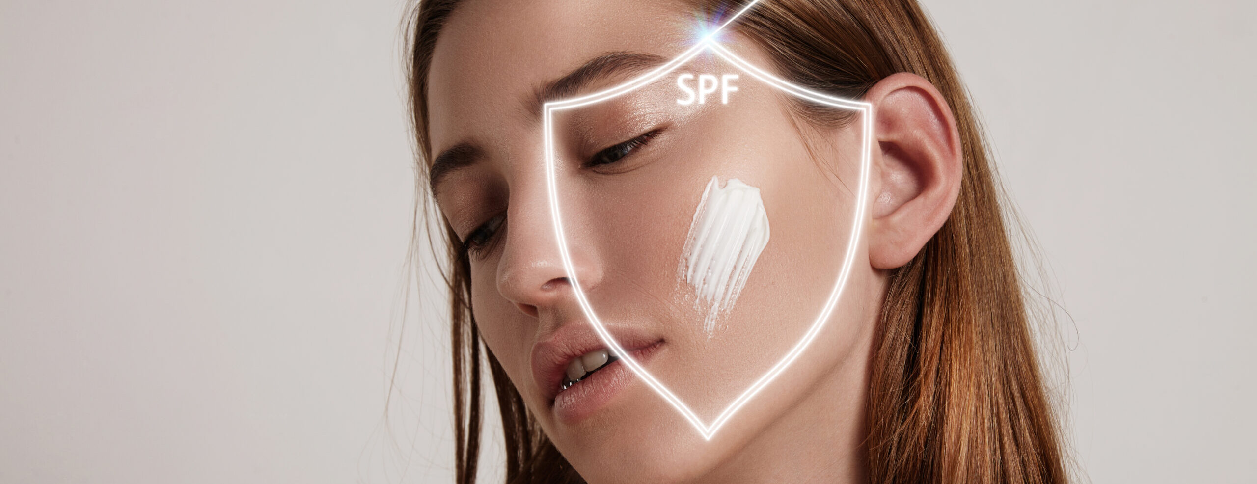 Woman s face into shield makes spf protection from ray scaled e1745560354384